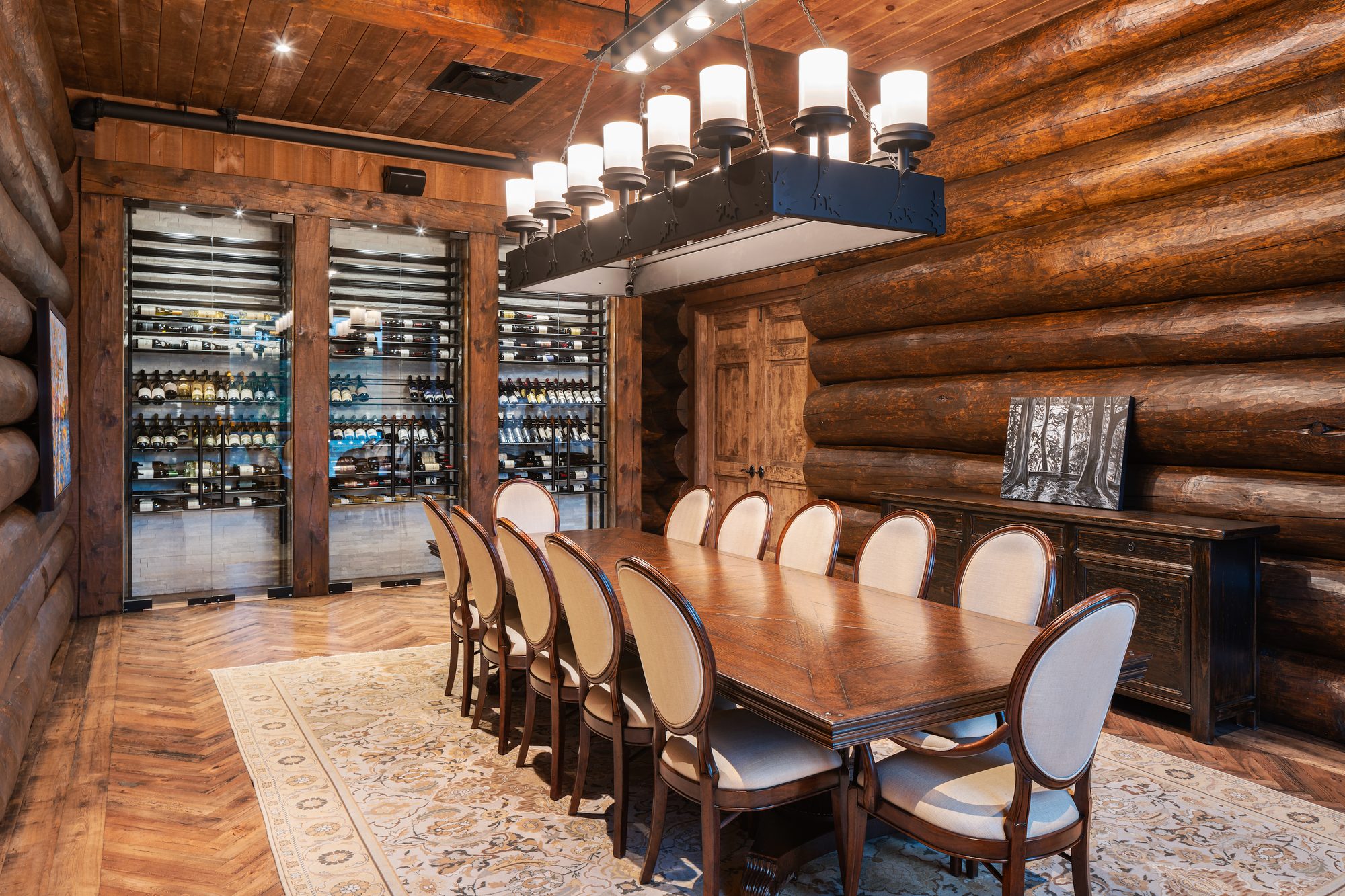 Captain's Quarters — one long table wrapped in glass wine walls