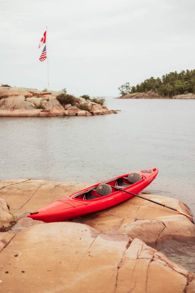 Red kayak on smooth granite
